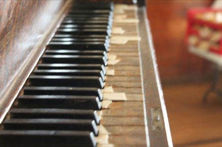 the old piano in the hall